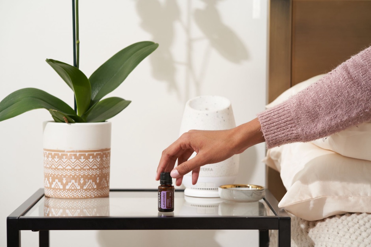 Lavender essential oil bottle with natural texture and clear glass